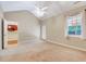 Bright bedroom featuring vaulted ceilings, a ceiling fan, and access to natural light at 5045 Homeplace Dr, Apex, NC 27539