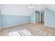 Bright bedroom featuring a ceiling fan and large window, offering a tranquil space at 5045 Homeplace Dr, Apex, NC 27539