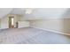 Large bonus room with neutral carpet and paint perfect for customizing to your needs at 5045 Homeplace Dr, Apex, NC 27539