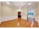 Formal dining room with hardwood flooring and trim work that opens to the kitchen at 5045 Homeplace Dr, Apex, NC 27539