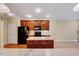 Well-designed kitchen featuring an island, stainless steel appliances, and easy access to the living area at 5045 Homeplace Dr, Apex, NC 27539