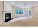 Cozy living room with a fireplace, ample natural light, and a seamless transition to the outdoor patio at 5045 Homeplace Dr, Apex, NC 27539
