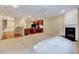 Open-concept living area with a fireplace, and easy access to kitchen, creating an ideal entertaining space at 5045 Homeplace Dr, Apex, NC 27539
