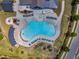Aerial view of community pool showcasing its unique shape and surrounding landscape at 508 White Oak Branch Ln, Apex, NC 27523