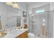 Clean, updated bathroom with a glass-enclosed shower and modern vanity with neutral colors at 508 White Oak Branch Ln, Apex, NC 27523