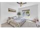 Bright bedroom features a lovely bed, neutral walls, recessed lights, and a window with a pleasant view at 508 White Oak Branch Ln, Apex, NC 27523
