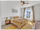 Bright bedroom featuring a ceiling fan and large window that offers ample natural light at 508 White Oak Branch Ln, Apex, NC 27523