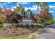 Entrance sign to Preserve at White Oak with lush landscaping and colorful trees at 508 White Oak Branch Ln, Apex, NC 27523