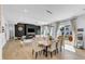 Spacious dining area connecting seamlessly to the living room and outdoor space, perfect for entertaining guests or enjoying Gathering meals at 508 White Oak Branch Ln, Apex, NC 27523