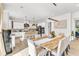 Open floor plan with kitchen island that flows into the dining area at 508 White Oak Branch Ln, Apex, NC 27523