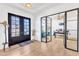 Bright foyer featuring hardwood floors, glass-paned doors, and an open view into the office at 508 White Oak Branch Ln, Apex, NC 27523