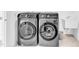 This laundry room features a modern black washer and dryer at 508 White Oak Branch Ln, Apex, NC 27523