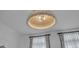 Modern lighting fixture with floral curtains at 508 White Oak Branch Ln, Apex, NC 27523
