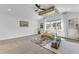Bright room features elegant decorations, neutral walls, recessed lights, ceiling fan, and a large window at 508 White Oak Branch Ln, Apex, NC 27523