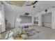 Bright room features a projector screen, recessed lights, ceiling fan, and a gray carpet at 508 White Oak Branch Ln, Apex, NC 27523