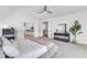 Bright primary suite features an ensuite bathroom, neutral tones, and a ceiling fan at 508 White Oak Branch Ln, Apex, NC 27523