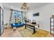 Well-lit home office featuring a modern desk, comfortable seating, and stylish decor at 508 White Oak Branch Ln, Apex, NC 27523