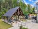 Community pavilion equipped with picnic tables and a playground, perfect for outdoor gatherings at 508 White Oak Branch Ln, Apex, NC 27523