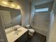 Bathroom featuring a single vanity, and a shower-tub combo with tile flooring at 51 Commons Cir, Clayton, NC 27520