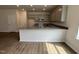 Modern kitchen with granite countertops, an island with a sink, stainless steel appliances, and lots of storage space at 51 Commons Cir, Clayton, NC 27520