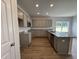 Elegant kitchen with granite countertops, stainless steel appliances, and ample cabinet space for storage at 51 Commons Cir, Clayton, NC 27520