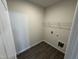 Functional laundry room equipped with vinyl flooring and washer and dryer hookups at 51 Commons Cir, Clayton, NC 27520