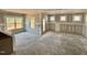 Spacious living room featuring multiple windows for ample natural light and bare drywall at 51 Commons Cir, Clayton, NC 27520