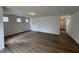 Spacious living room featuring wood floors, natural light, and an open layout perfect for relaxing and entertaining at 51 Commons Cir, Clayton, NC 27520