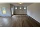Bright living room showcasing beautiful wood floors, natural light, and a functional, spacious open design at 51 Commons Cir, Clayton, NC 27520