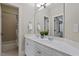 Bathroom with double sinks, a large mirror, updated vanity, and a shower/tub combo at 5102 Highcroft Dr, Cary, NC 27519