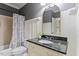 Bathroom with dark granite counters, shower, mirror, and toilet at 5102 Highcroft Dr, Cary, NC 27519