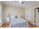 Bright bedroom features wainscoting, a twin bed and a nightstand at 5102 Highcroft Dr, Cary, NC 27519
