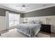 Comfortable bedroom with a ceiling fan, wainscoting and large window at 5102 Highcroft Dr, Cary, NC 27519