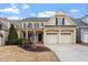 Charming two-story home with a two-car garage and inviting front porch at 5102 Highcroft Dr, Cary, NC 27519