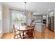 Eat-in kitchen features a wooden table, chandelier and stainless steel appliances at 5102 Highcroft Dr, Cary, NC 27519
