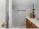 Bathroom with a shower and a vanity with wooden cabinets at 5136 Liberty Grove Rd, Liberty, NC 27298