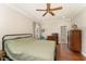 Bedroom with hardwood floors, ceiling fan, ensuite bath, and closet at 5136 Liberty Grove Rd, Liberty, NC 27298