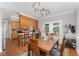 Dining area featuring a wooden table, chairs, and access to the deck through glass doors at 5136 Liberty Grove Rd, Liberty, NC 27298