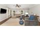 Bright living room featuring hardwood floors, a comfortable sofa and large windows at 5136 Liberty Grove Rd, Liberty, NC 27298