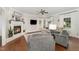 Inviting living room showcasing a fireplace, hardwood floors and neutral furnishings at 5136 Liberty Grove Rd, Liberty, NC 27298