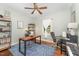 Office with hardwood floors, large window, blue rug, and desk workspace at 5136 Liberty Grove Rd, Liberty, NC 27298