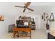 Office space with white walls, carpet, large desk, and shelves for display at 5136 Liberty Grove Rd, Liberty, NC 27298