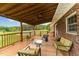 Spacious outdoor patio with a ceiling fan, string lights, and comfortable seating at 5136 Liberty Grove Rd, Liberty, NC 27298