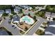 An aerial view highlights a community pool and playground, perfect for Gathering fun and neighborhood gatherings at 524 Rowanwood Way, Apex, NC 27523