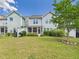 Well-maintained backyard with lush grass, mature landscaping, and an inviting patio, ideal for relaxation and entertaining at 524 Rowanwood Way, Apex, NC 27523