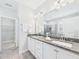 Modern bathroom features dual sinks, granite counters, and modern fixtures at 524 Rowanwood Way, Apex, NC 27523