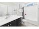 Clean bathroom with white vanity, shower with curtain, and neutral wall color at 524 Rowanwood Way, Apex, NC 27523