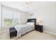 Bedroom with a ceiling fan, large window, and standard bed set at 524 Rowanwood Way, Apex, NC 27523