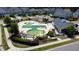 Aerial view of the community pool, playground, and surrounding neighborhood homes at 524 Rowanwood Way, Apex, NC 27523