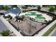 Aerial view showcasing the community pool, playground, and clubhouse in a Gathering-friendly neighborhood at 524 Rowanwood Way, Apex, NC 27523
